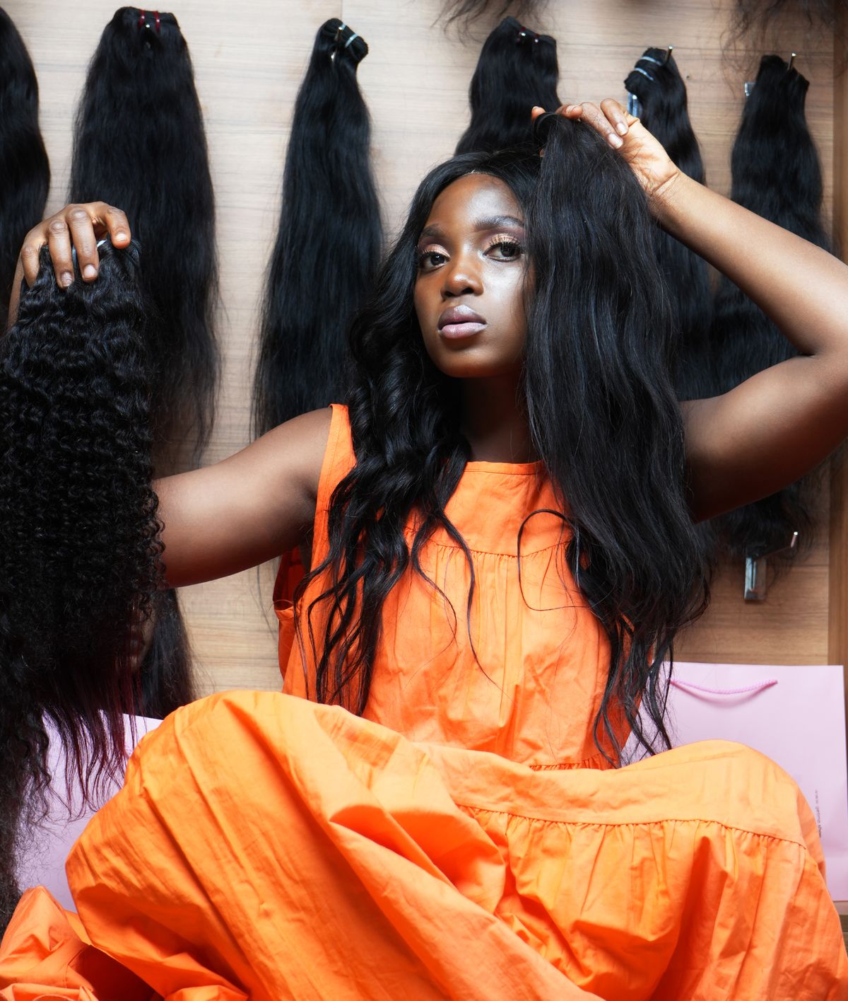 Young woman trying different wigs